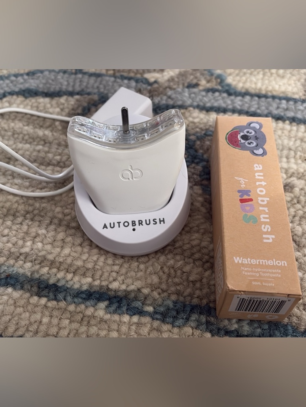 Autobrush Electric Toothbrush Charging Stand - White and brand new toothpaste